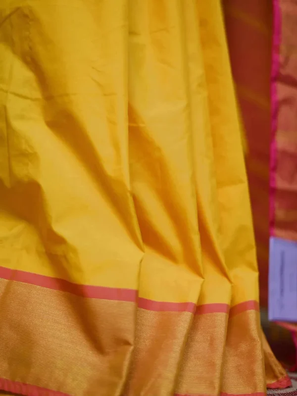 Yellow color with pink border kanjivaram work on Satin Silk Saree