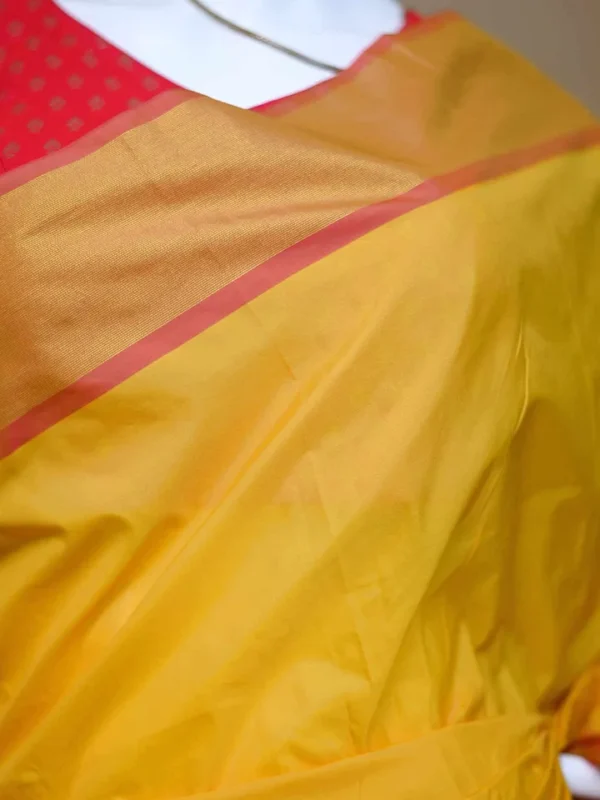 Yellow color with pink border kanjivaram work on Satin Silk Saree