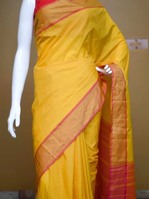 Yellow color with pink border kanjivaram work on Satin Silk Saree