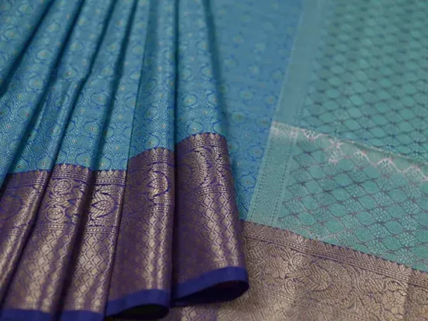 Aqua Blue with Golden Border Tanchuee work on Kora silk saree
