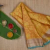 Yellow with Green Border Tanchuee work on Kora silk saree