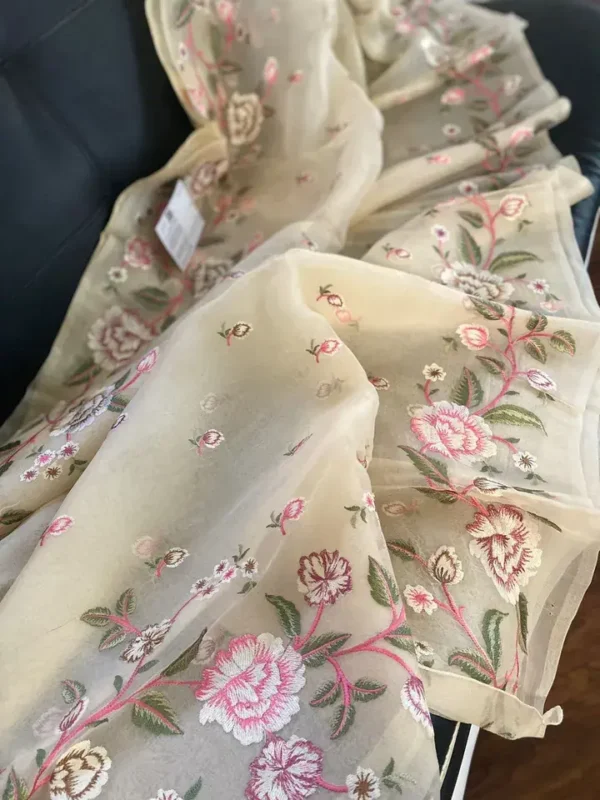 Cream body with flower work border Organza silk saree