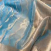 Light blue body with golden zari border on Organza silk saree