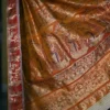 Biscuit on Red n Golden Zari work n Red anchal Baluchuri Pure Silk saree
