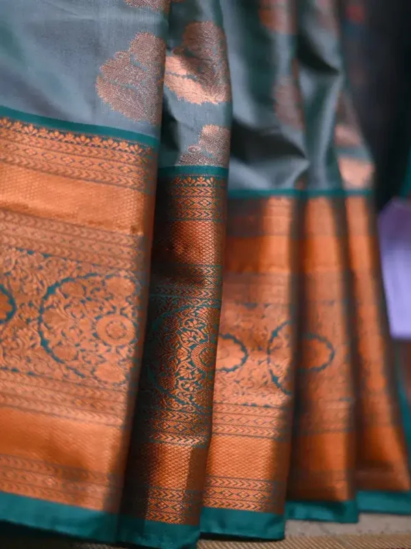 Green color with copper jari border kanjivaram work on Pure silk saree