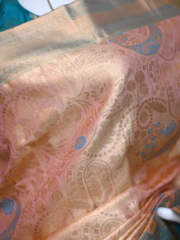 Peach color with sky blue border kanjivaram work on Pure silk saree