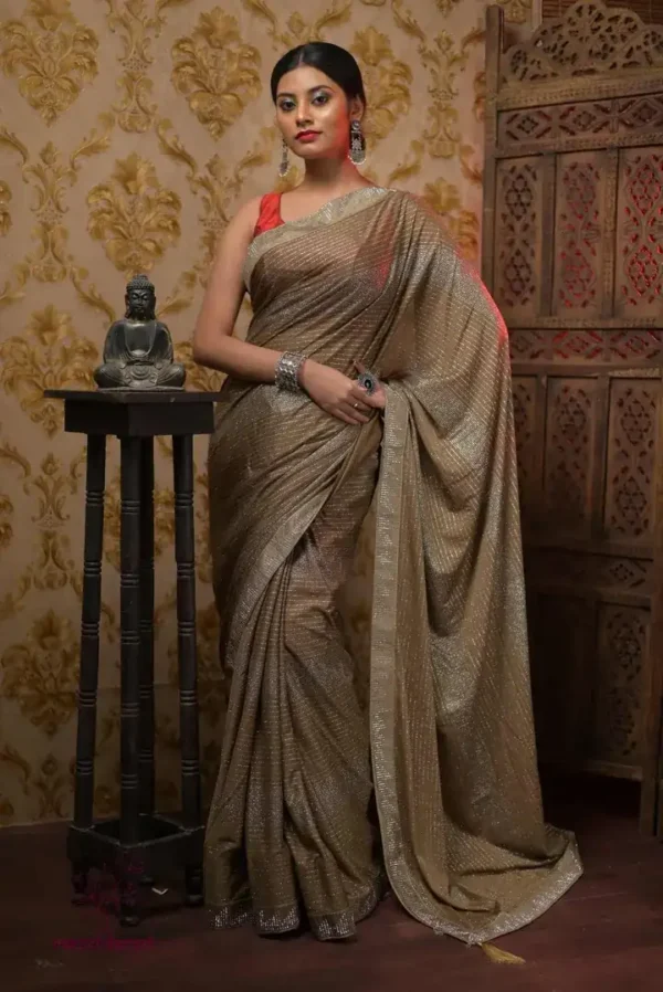 Sap Green Shimmer Stone work Border Pure crape silk Saree