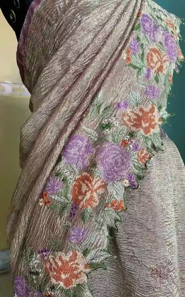 Wine on crush cutwork border with tussles on Tissue saree