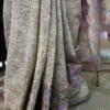 Wine on crush cutwork border with tussles on Tissue saree