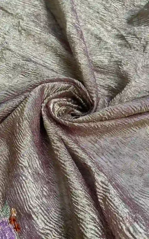 Wine on crush cutwork border with tussles on Tissue saree