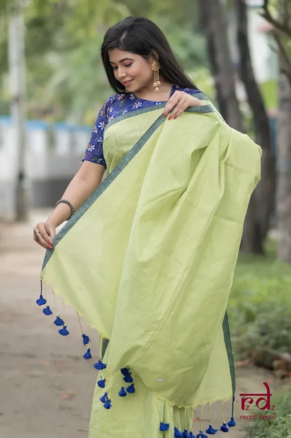 Pesta Green Handloom resham border Tussel on Tissue Khadi Saree