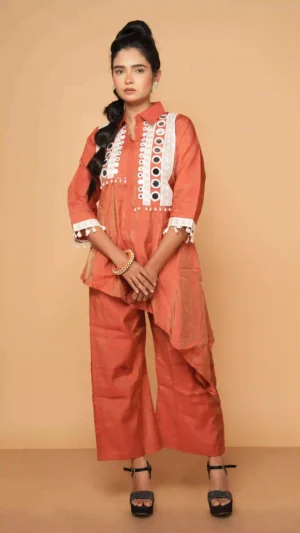 Rust-Red Collared Asymmetric Kurta Set with Circular Mirror-Work and Lace Borders | Ethnic Essentials 2026